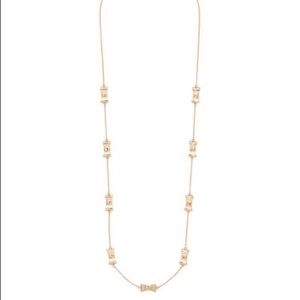 Kate Spade take a bow necklace in gold. Long length.
